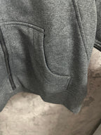 Dark gray hoodie with side pocket and curved front panel