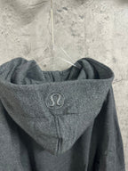 Dark gray hooded sweatshirt with drawstring and circular chest logo