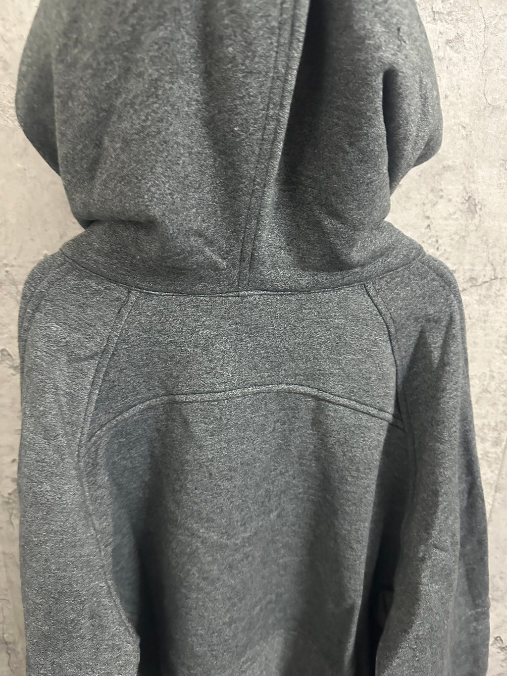Dark gray hooded sweatshirt with kangaroo pocket and front seam
