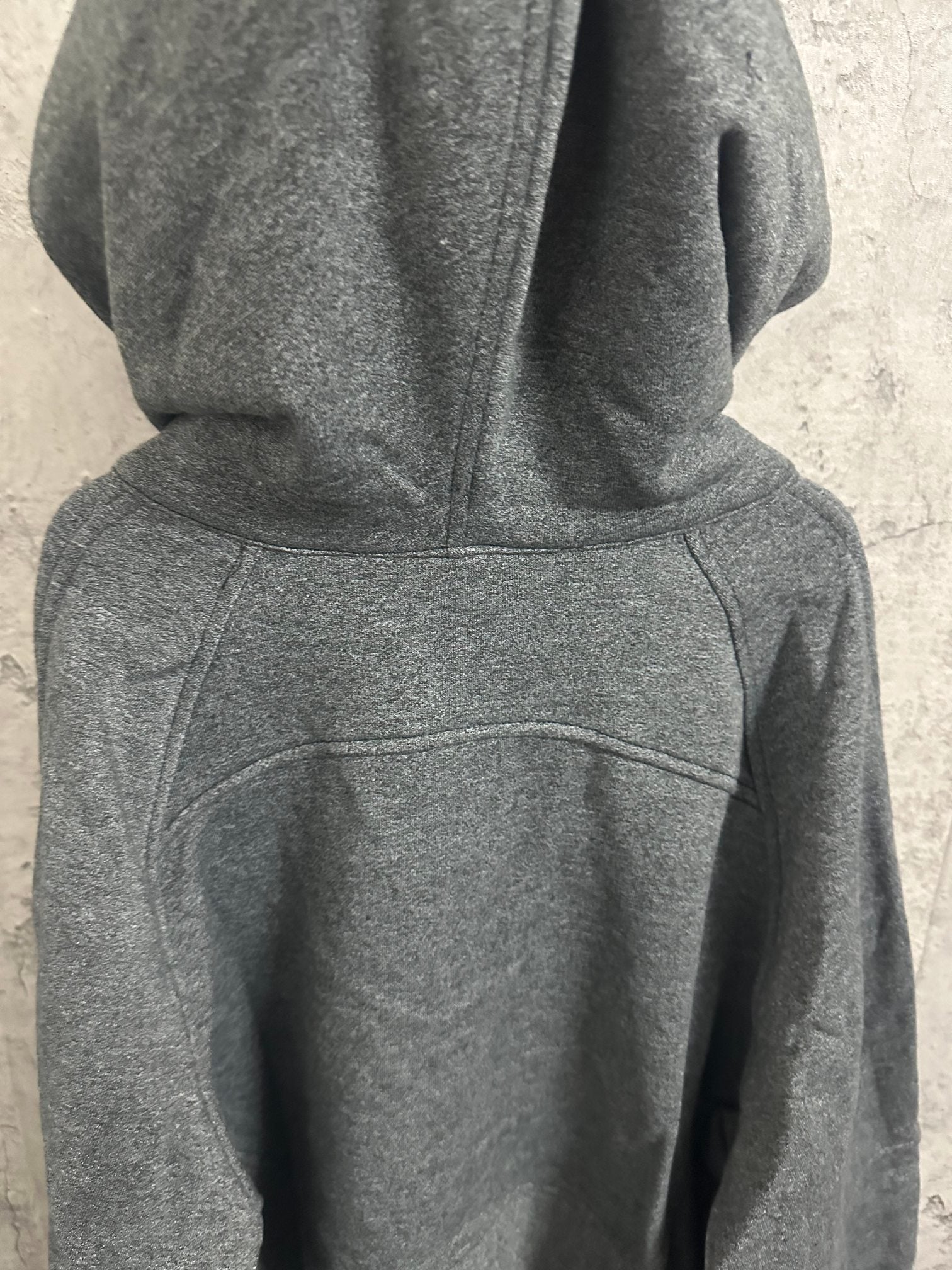 Dark gray hooded sweatshirt with kangaroo pocket and front seam