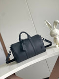 Louis Vuitton barrel bag in dark navy with top handles and shoulder strap