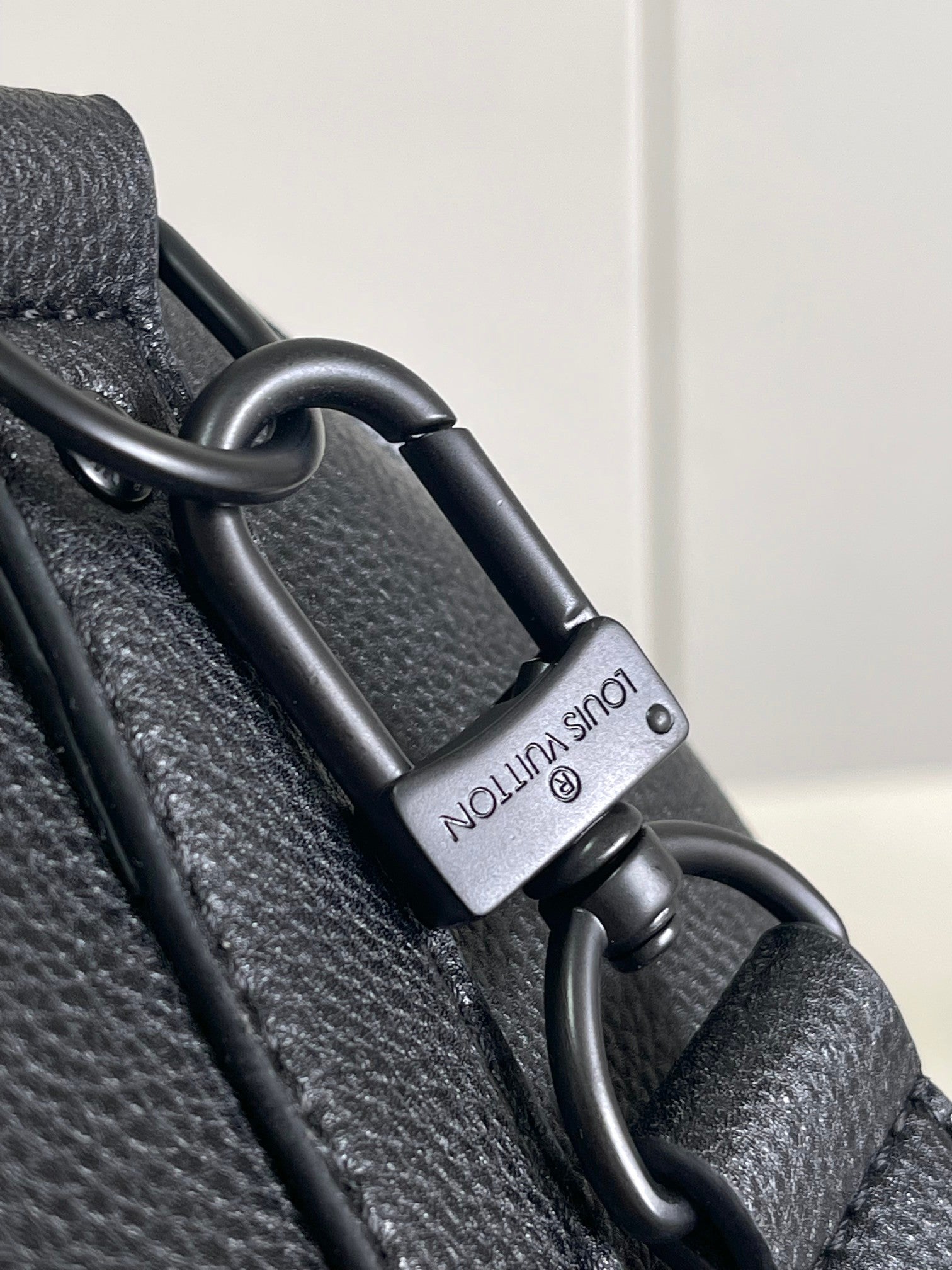 Louis Vuitton bag strap with metal clasp and engraved strap label