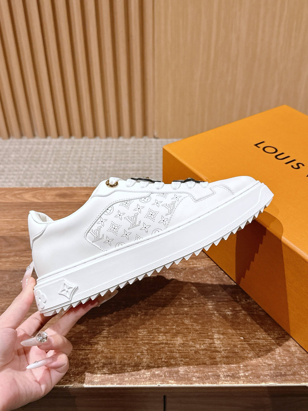 White Louis Vuitton sneakers, embossed monogram pattern, thick rubber sole