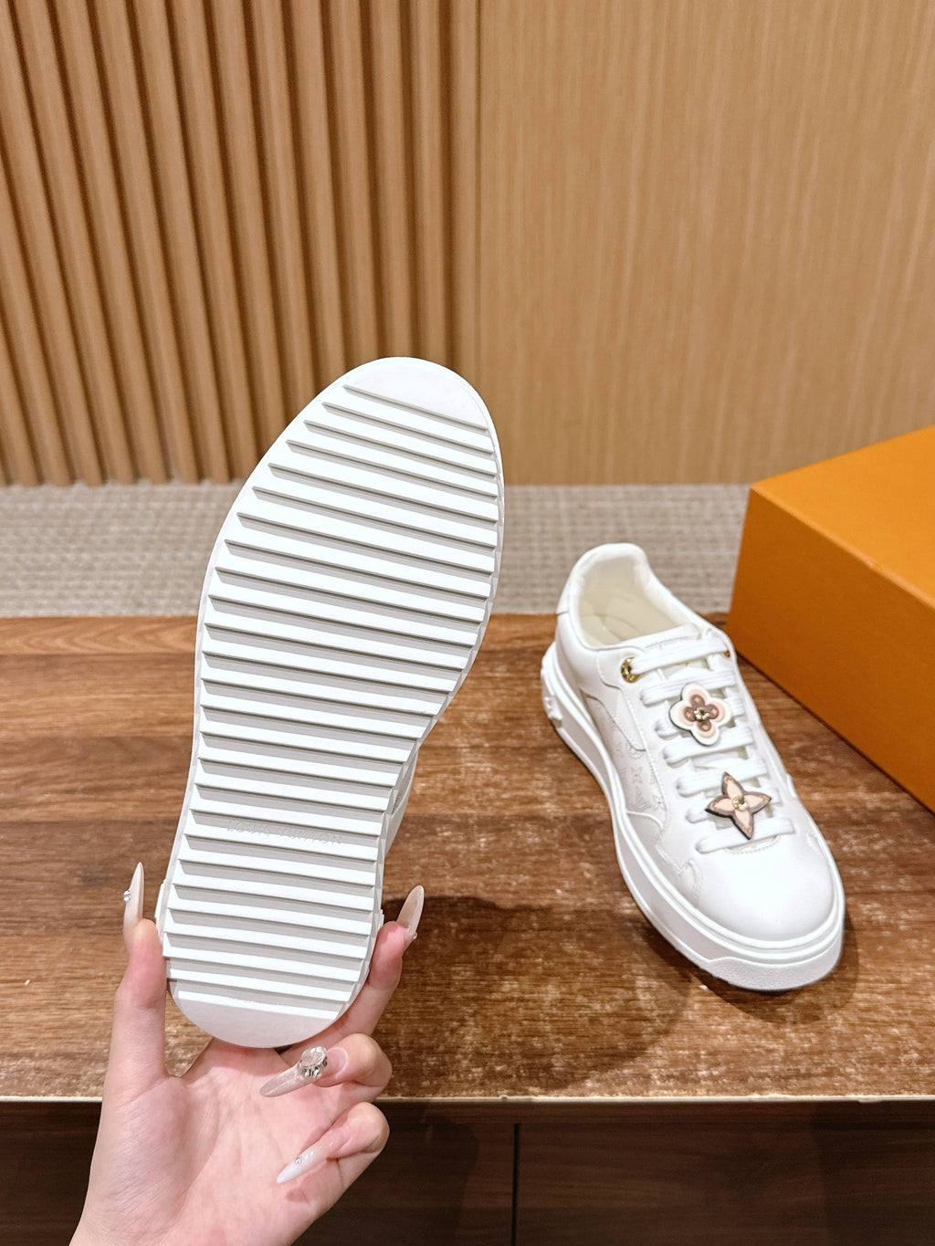 White Louis Vuitton sneakers outsole view with ridged rubber sole
