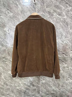 Brown jacket back view with full-length seams and zip closure at hem