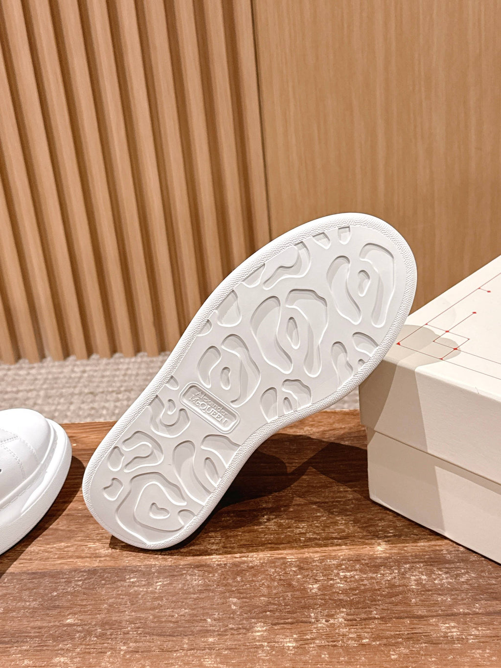 White sneaker outsole with textured tread pattern, Alexander McQueen