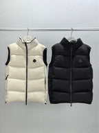 Quilted hooded puffer vests, light cream and black, front zipper and small logo