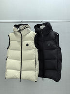 Quilted hooded puffer vests in light cream and black, standing collar and zip-front