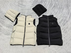 Folded hooded puffer vests in light cream and black, quilted sections and zip-front