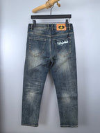 Prada denim pants in light wash blue with back pockets and logo patch