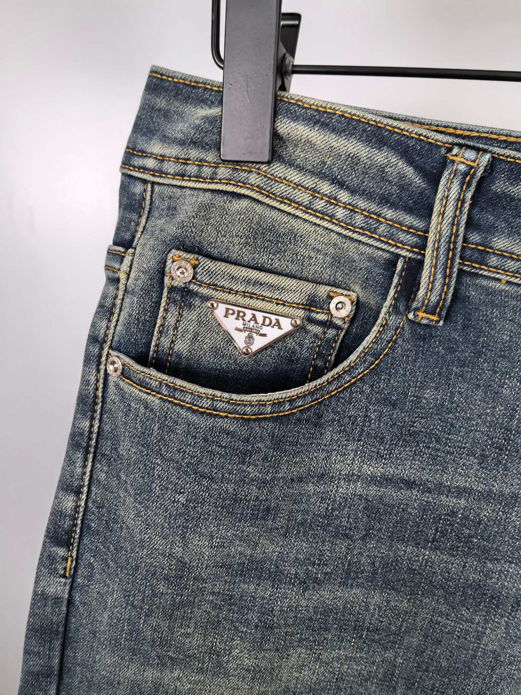 Prada denim pants front pocket with metal buttons and stitched trim