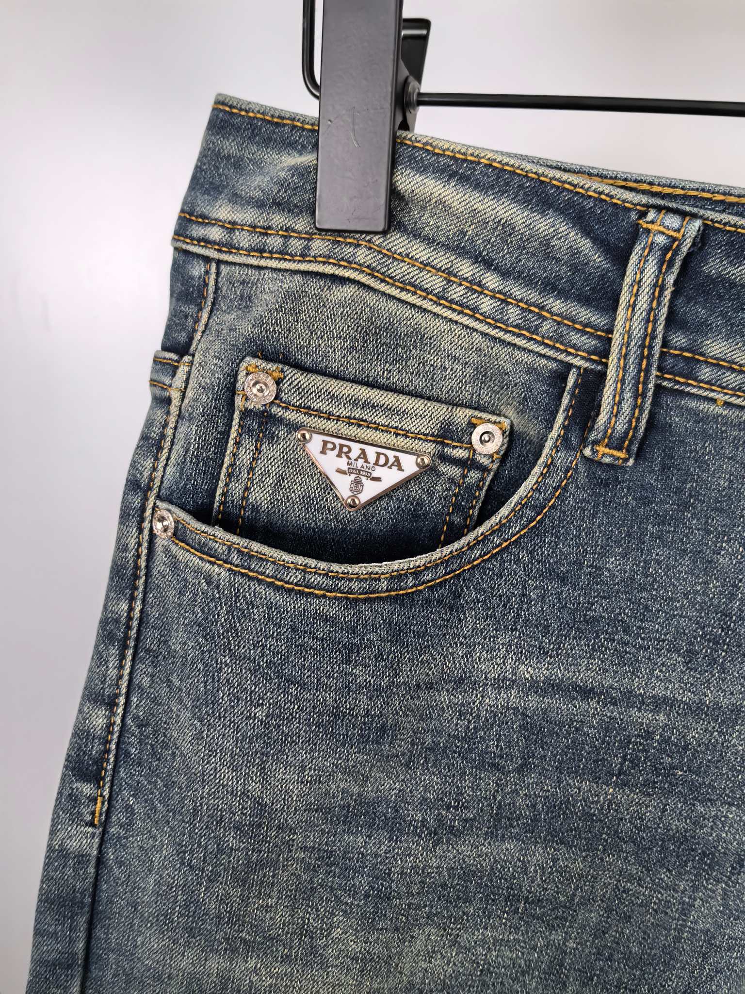 Prada denim pants front pocket with metal buttons and stitched trim