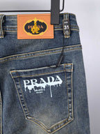 Prada denim pants back with logo patch and size 31 tag on waistband