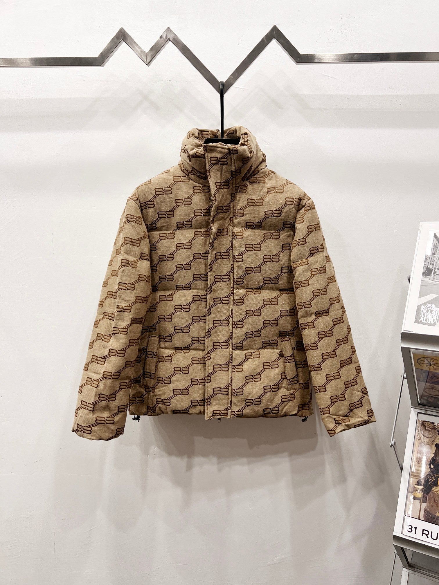 Balenciaga hooded puffer jacket in beige with repeating logo pattern, full front zip