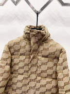 Balenciaga hooded puffer jacket close-up in beige with repeating logo pattern and front zip