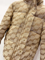 Balenciaga hooded puffer jacket in beige with repeating logo pattern, snap placket details