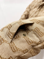Balenciaga puffer jacket sleeve cuff in beige with repeating logo pattern and button