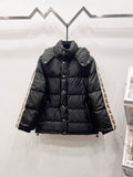 Dark long puffer jacket with hood, button front, and quilted panels