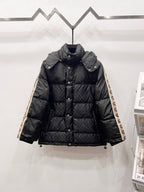Dark long puffer jacket with hood, button front, and quilted panels