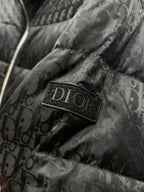 Dior logo patch on quilted puffer jacket fabric