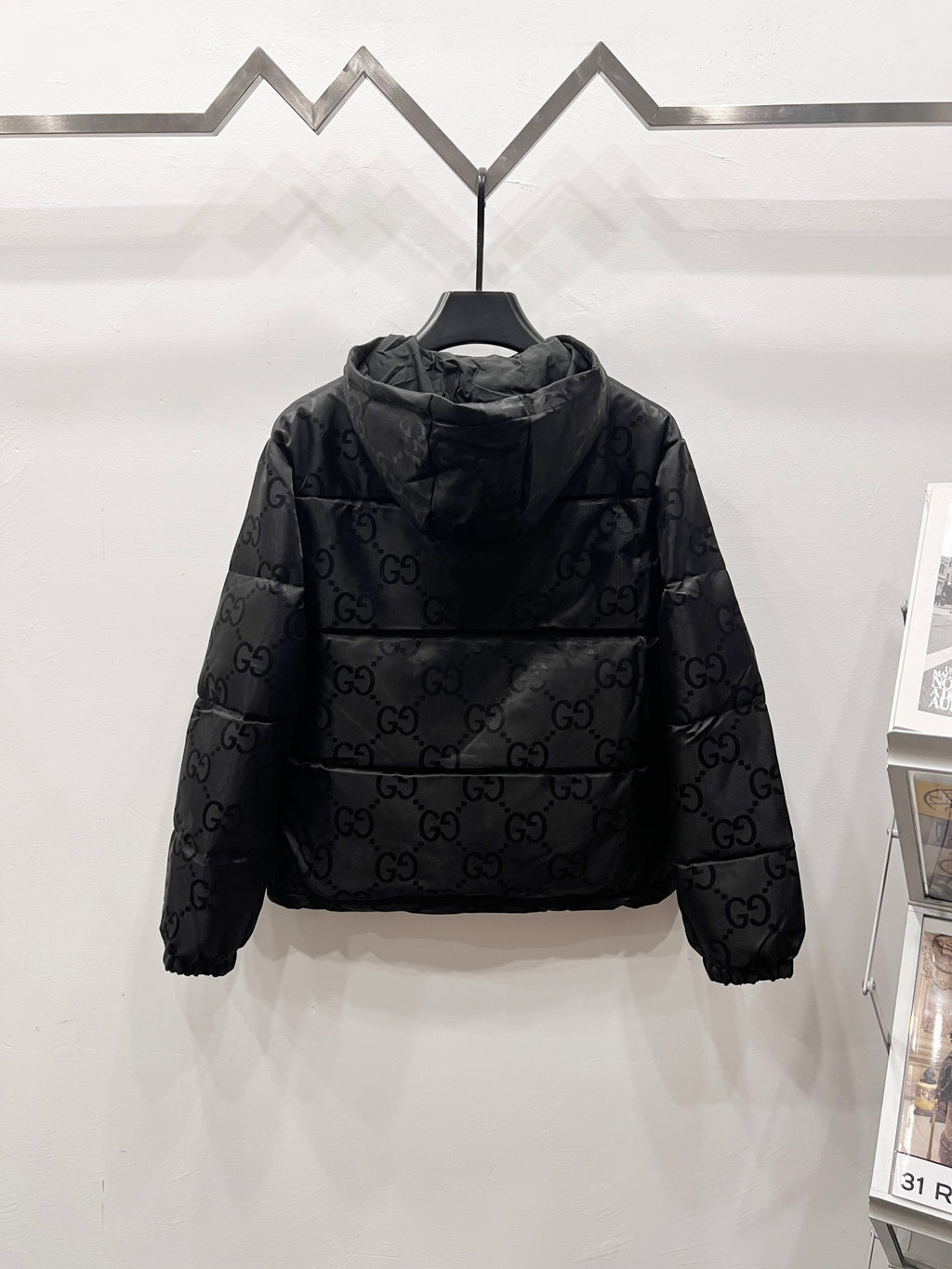 Gucci hooded puffer jacket with allover GG logo pattern and front zipper