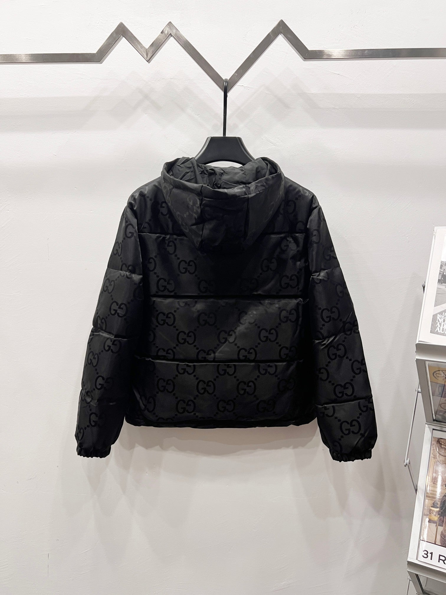 Gucci hooded puffer jacket with allover GG logo pattern and front zipper