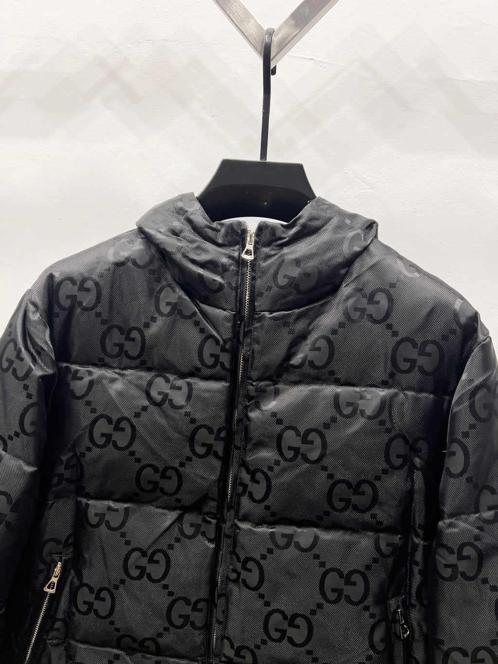 Gucci hooded puffer jacket close-up with GG monogram allover and zip front