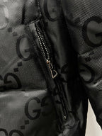 Gucci puffer jacket zipper pocket area with GG pattern on dark fabric