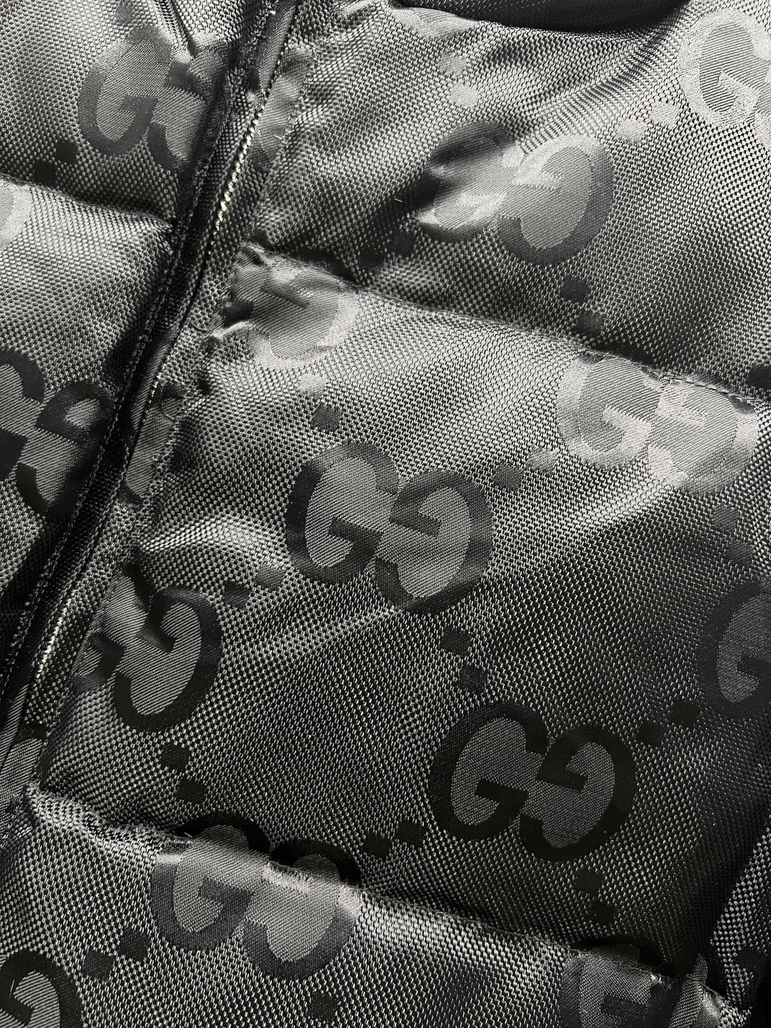 Gucci quilted puffer jacket panel with GG monogram print and zipper seam