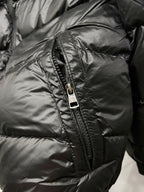 Moncler puffer jacket close-up, dark black front zipper and quilted stitching