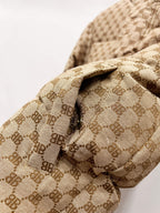 Gucci puffer jacket sleeve detail in beige monogram fabric with quilted patch panel