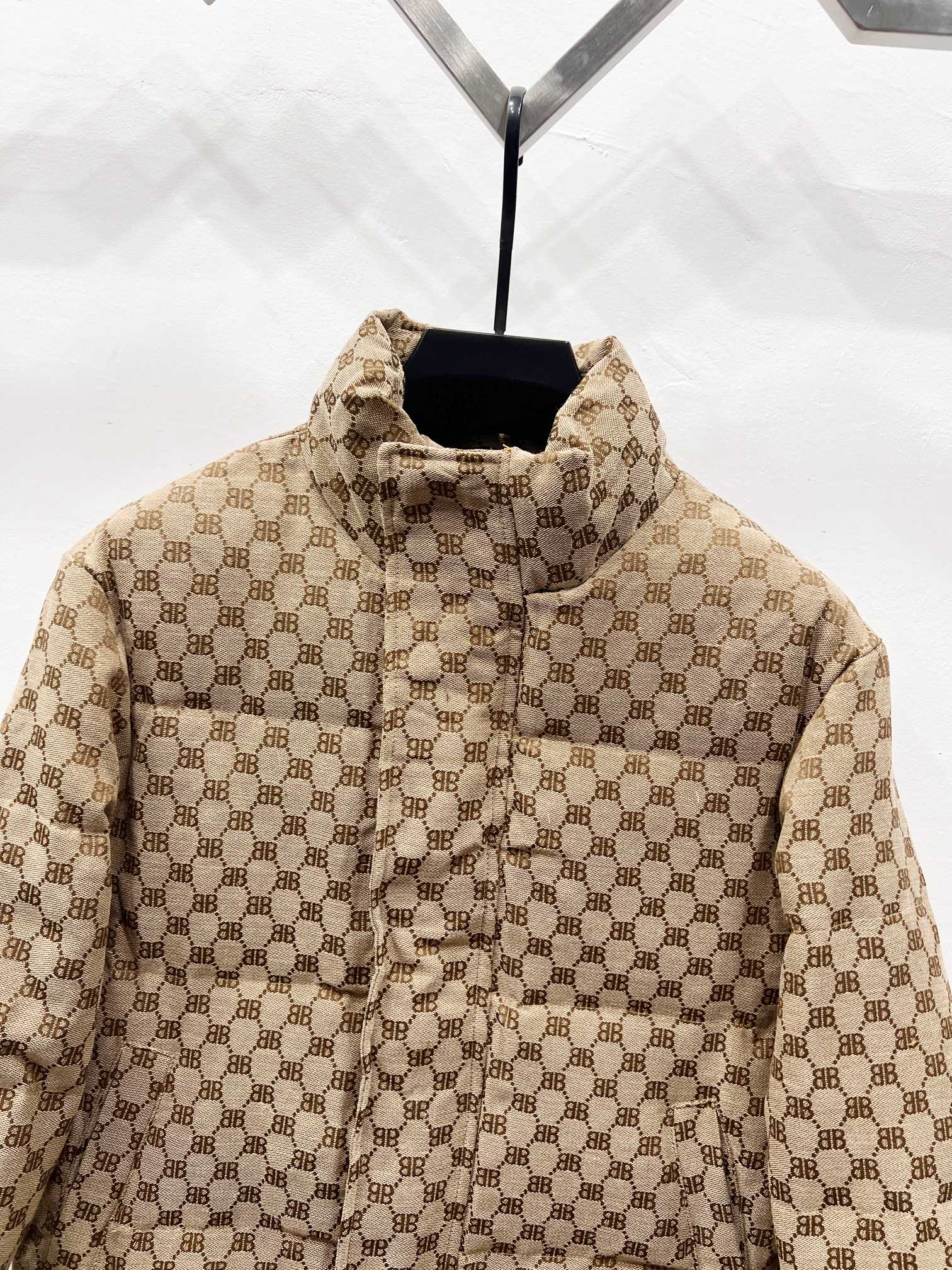 Gucci puffer jacket in beige with allover monogram, high collar and front button placket