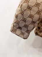 Gucci puffer jacket sleeve end detail in beige monogram fabric