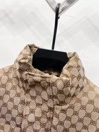 Gucci puffer jacket interior view with beige monogram lining and standing collar