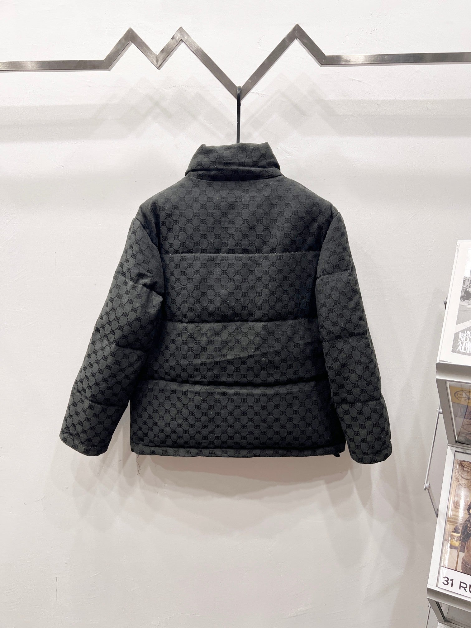 Dark gray long puffer jacket, back view, stand collar and quilted monogram pattern