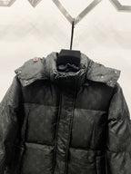 Black long puffer jacket with stand collar and buttoned side snaps