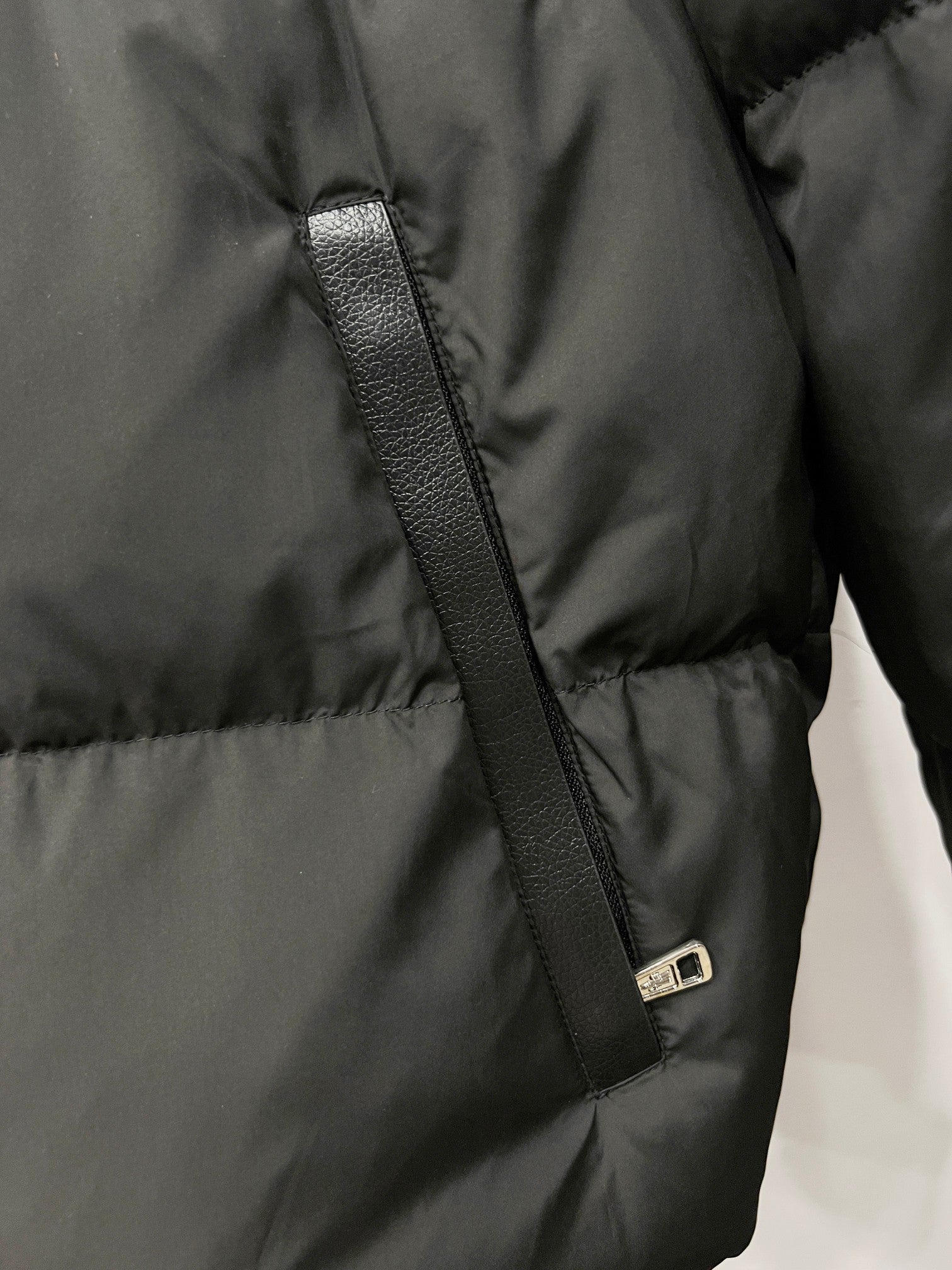 Moncler long puffer jacket zipper with metal pull on dark padded panel