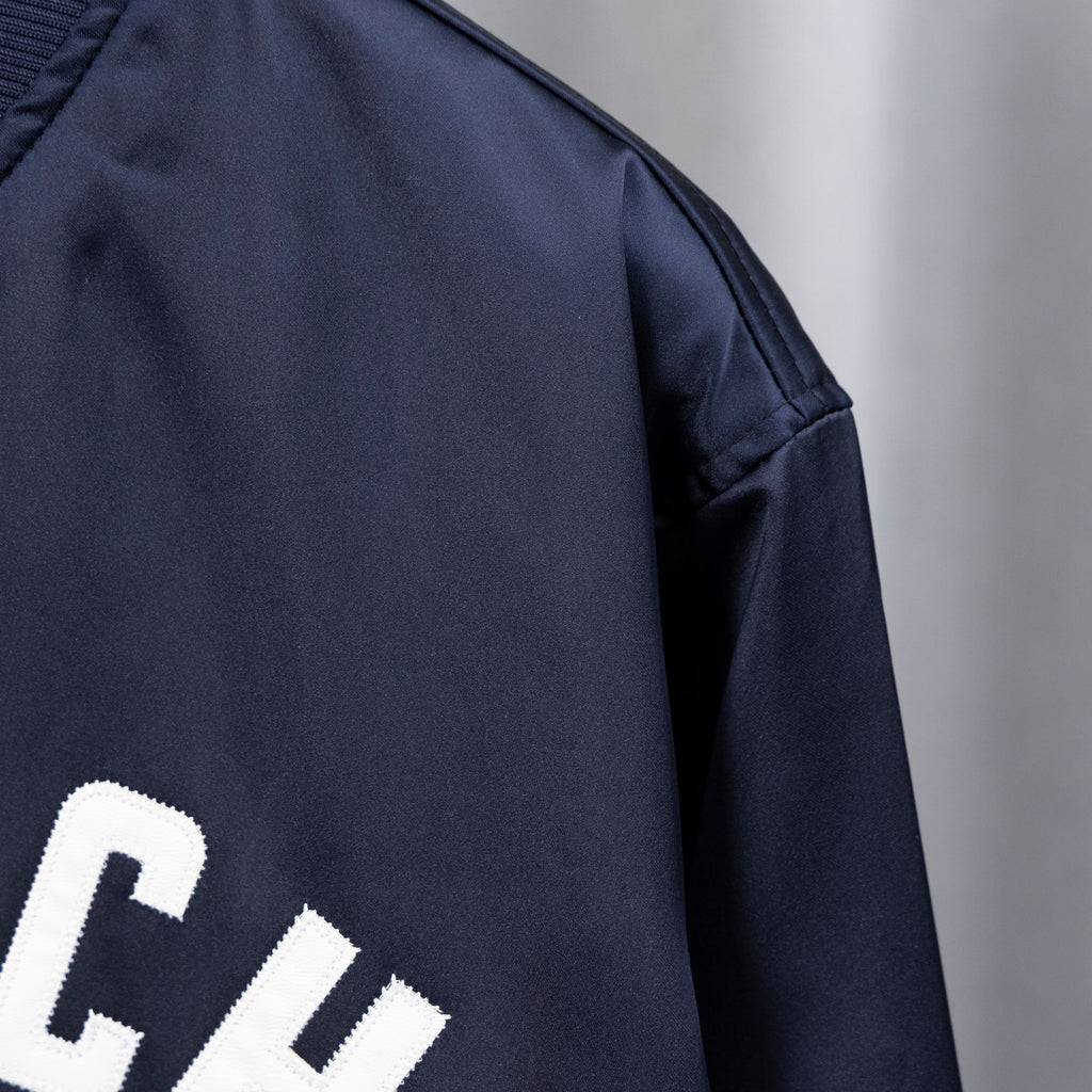 Givenchy dark navy bomber jacket sleeve with smooth satin-like finish