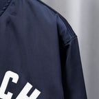 Givenchy dark navy bomber jacket sleeve with smooth satin-like finish