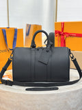 Louis Vuitton leather handbag with top handles and shoulder strap, dark gray.