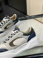 FENDI unisex lace-up sneakers, close side view with mesh panel and navy trim