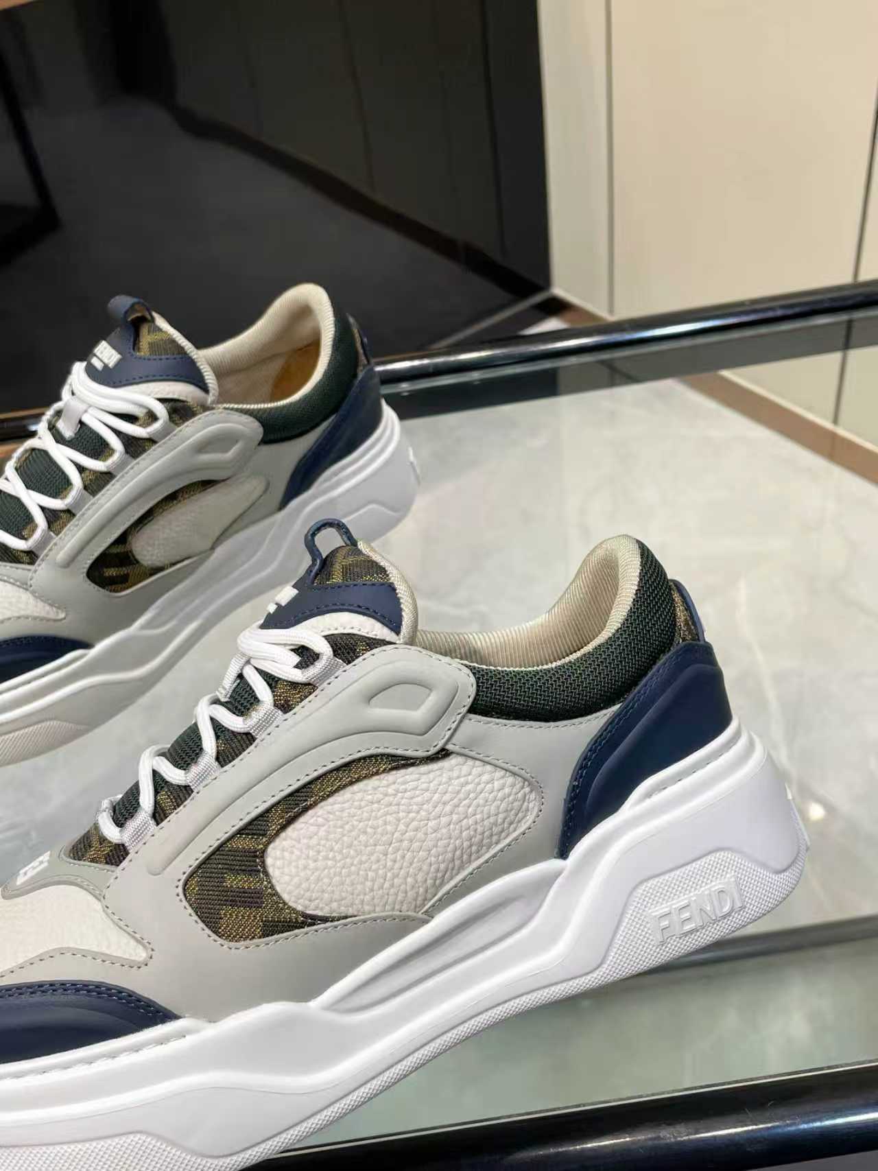 FENDI unisex lace-up sneakers, close side view with mesh panel and navy trim