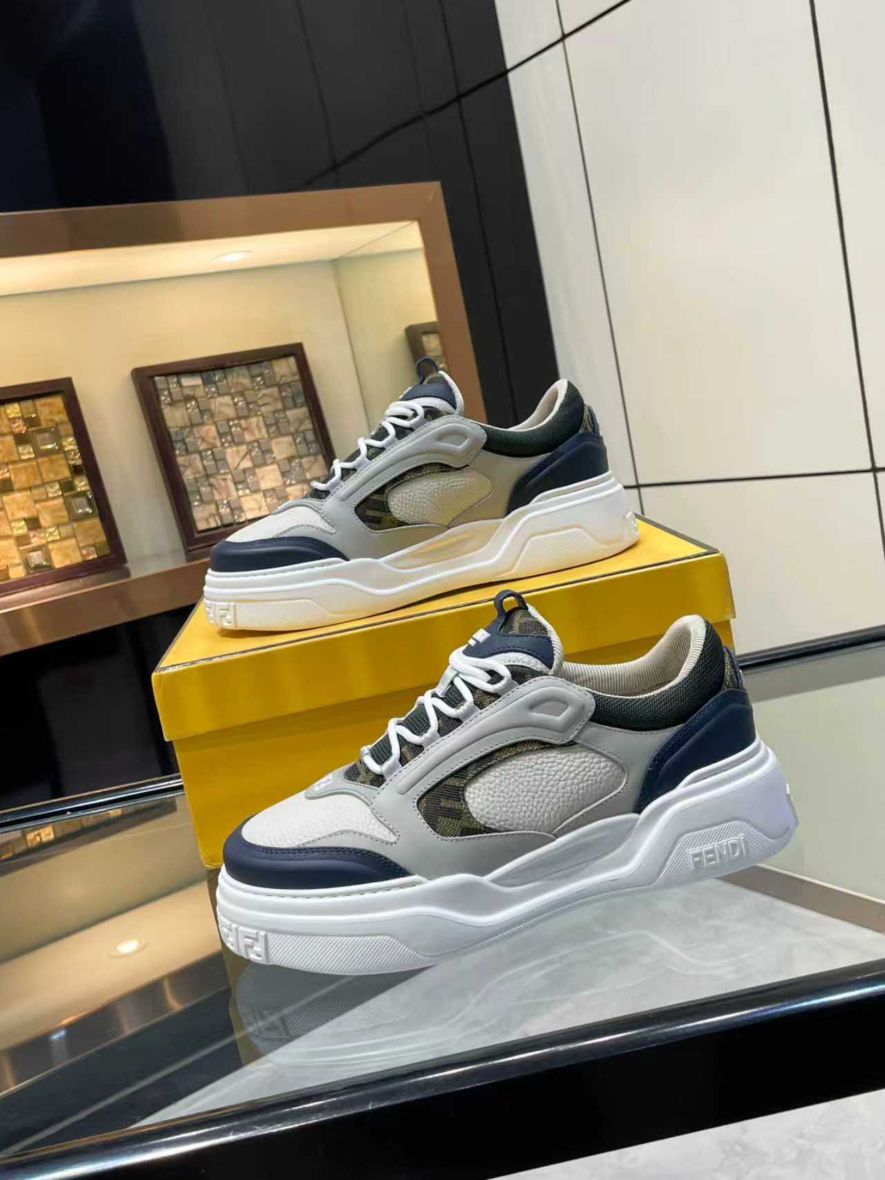 FENDI unisex lace-up sneakers, front angle with white panels and navy toe and heel