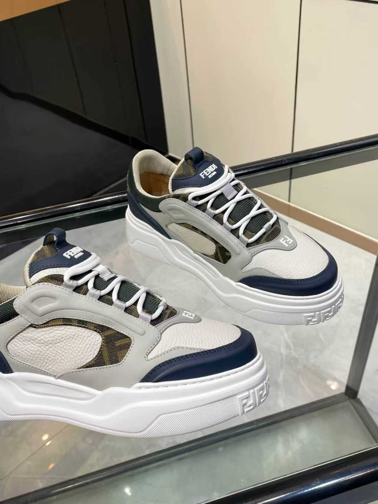 FENDI unisex lace-up sneakers, angled view showing white laces and navy heel detail