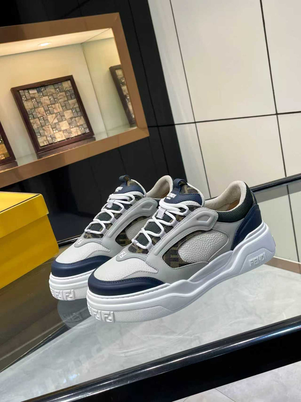 FENDI unisex lace-up sneakers, full side view in white with navy accents and thick sole