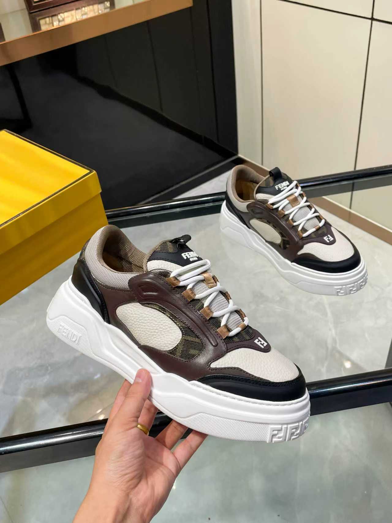Fendi unisex sneaker detail view with brown, beige, and black panels and white sole