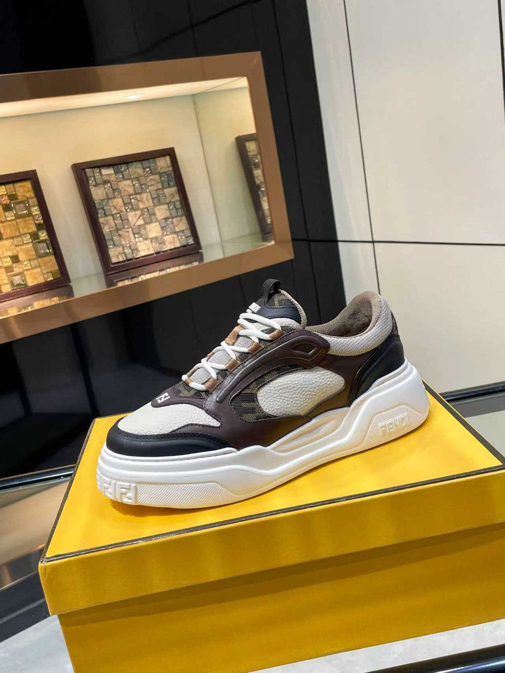 Fendi unisex chunky lace-up sneakers in dark brown, black, and gray with white sole