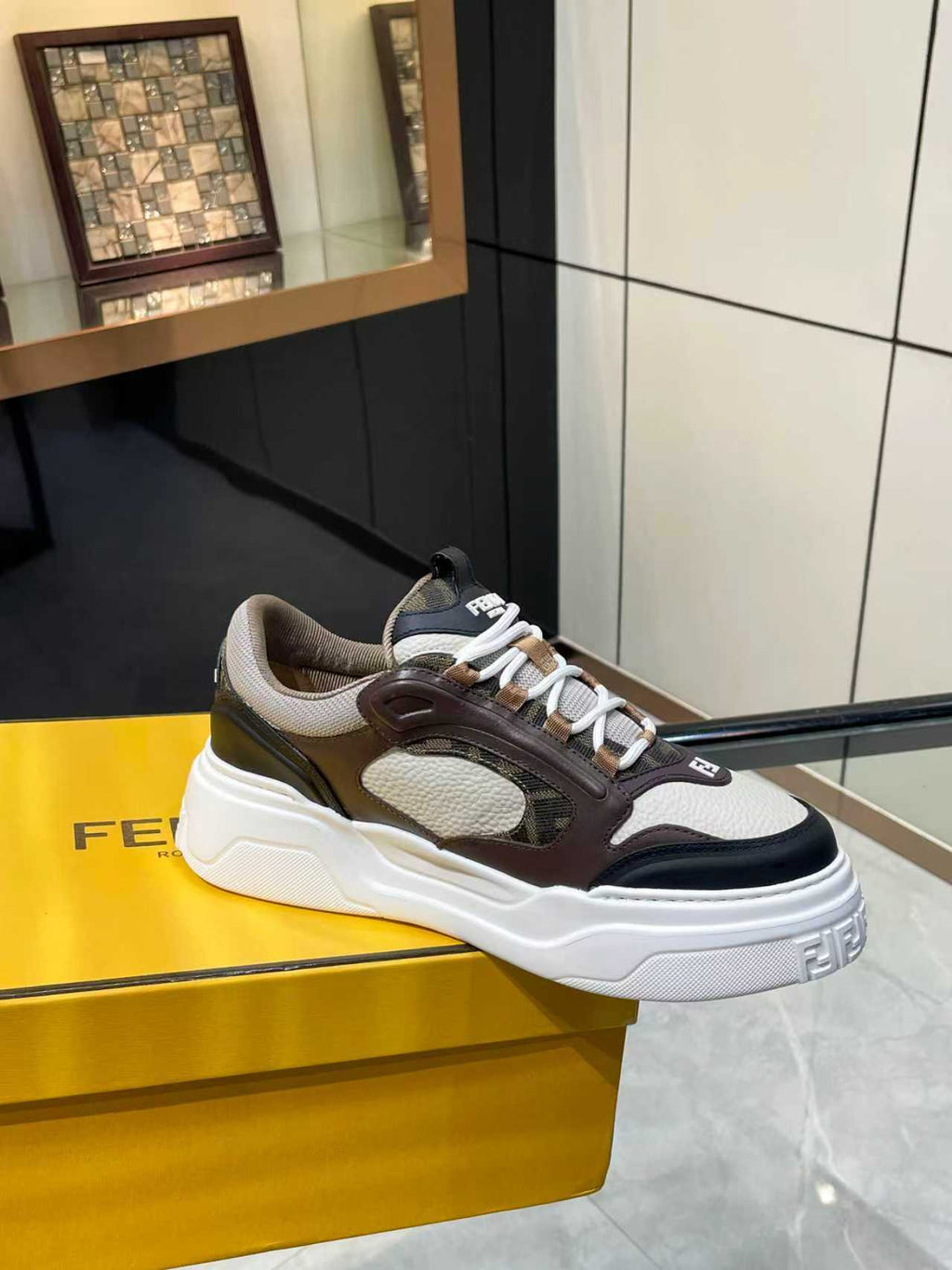 Fendi unisex low-top sneakers with white laces and chunky sole in dark brown and gray