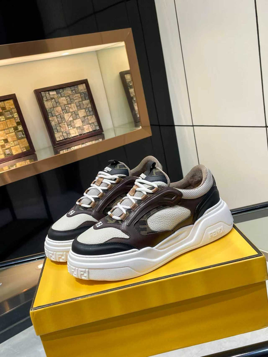 Fendi unisex chunky lace-up sneakers in black, brown, and gray with white platform sole