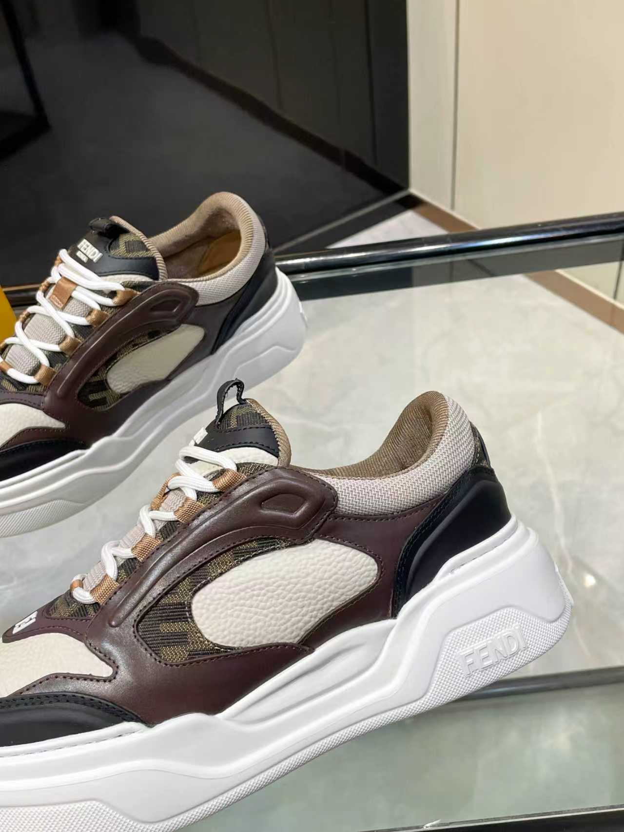 Close-up of Fendi unisex sneaker upper with dark brown, beige, and black panels